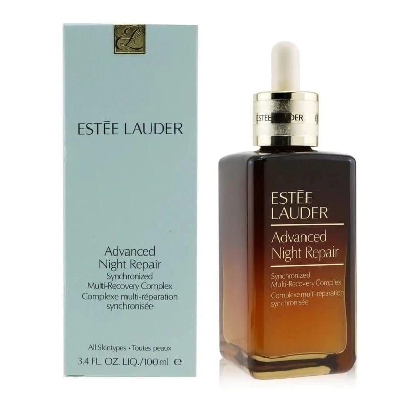 Estée Lauder Advanced Night Repair skincare set, featuring the amber glass dropper bottle next to its light blue packaging box.